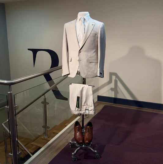 Stone linen wedding guest suit with tan brown Derby shoes at Ryle Menswear, Tralee
