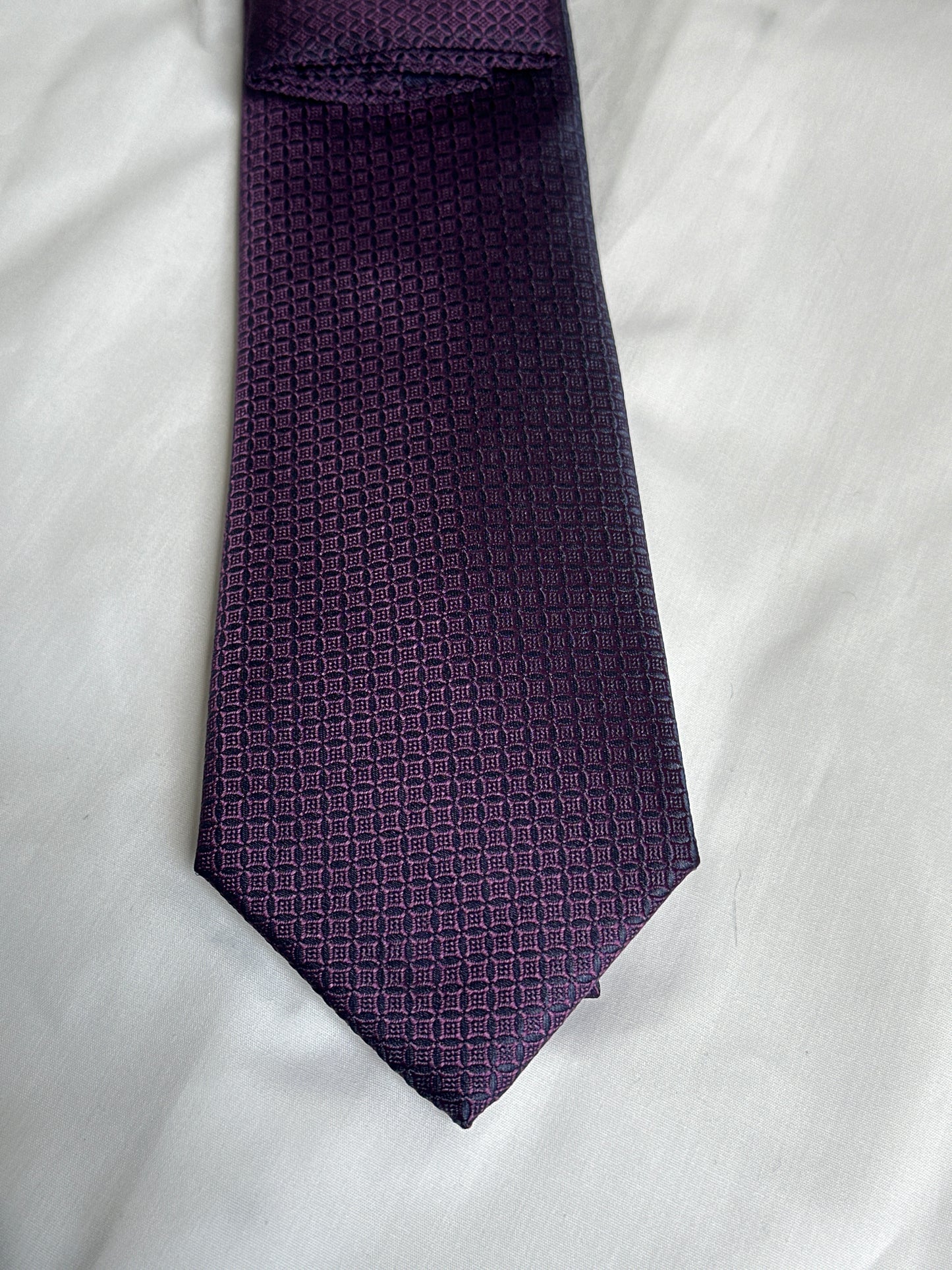 Purple micro-square tie and matching pocket square at Ryle Menswear, Tralee