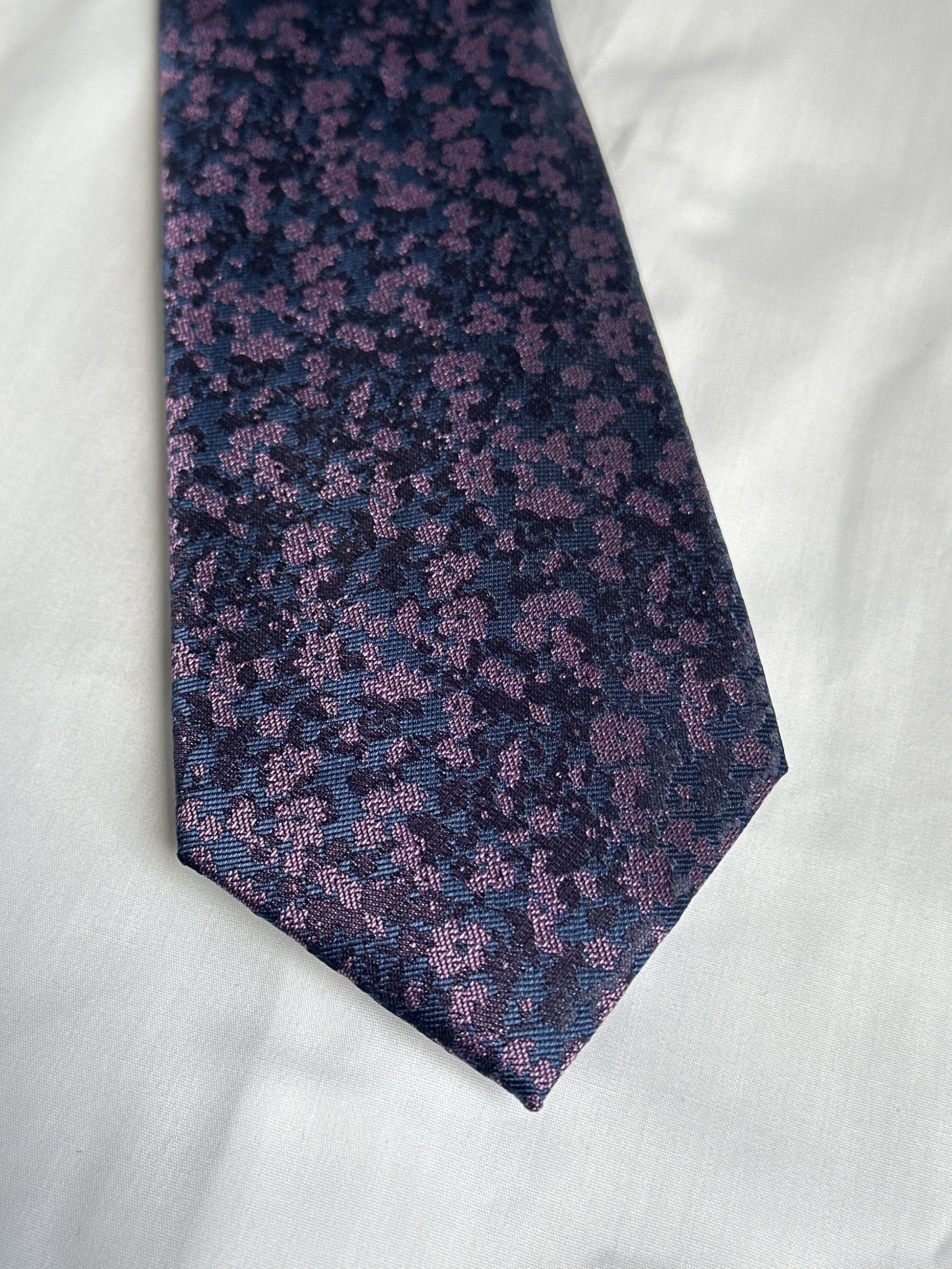Purple speckled floral tie and matching pocket square at Ryle Menswear, Tralee