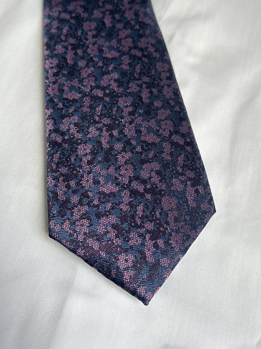 Purple speckled floral tie and matching pocket square at Ryle Menswear, Tralee