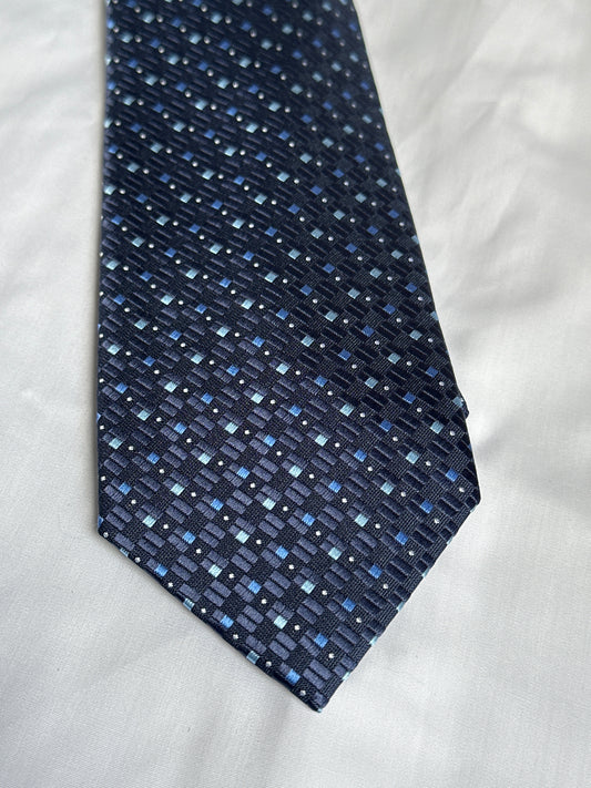 Dark blue geometric tie and matching pocket square at Ryle Menswear, Tralee