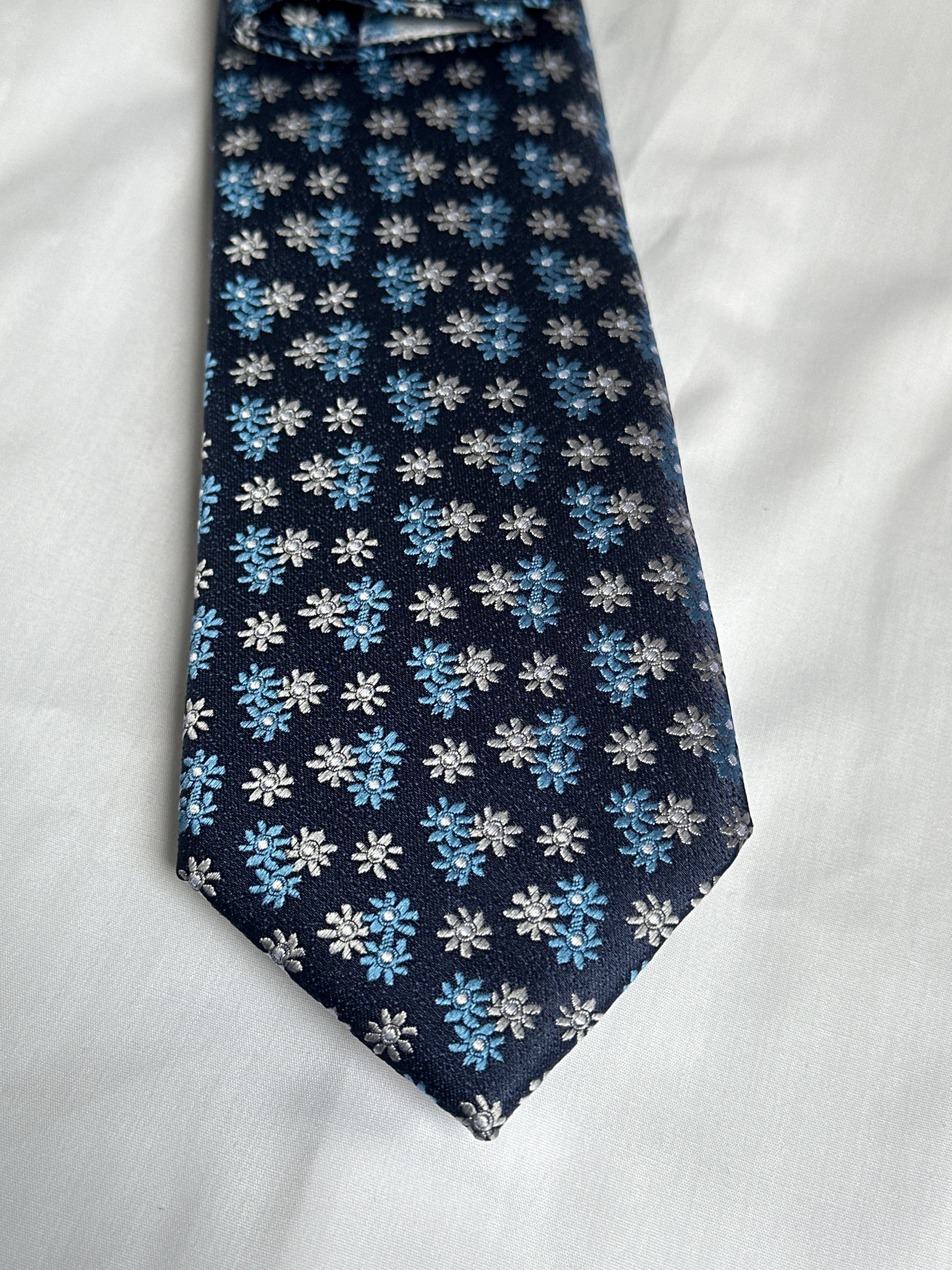 Navy tie with blue and white flowers, with matching pocket square — Ryle Menswear, Tralee