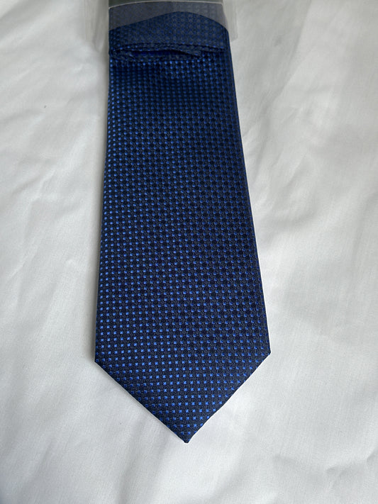 Dark blue micro-square tie and matching pocket square at Ryle Menswear, Tralee