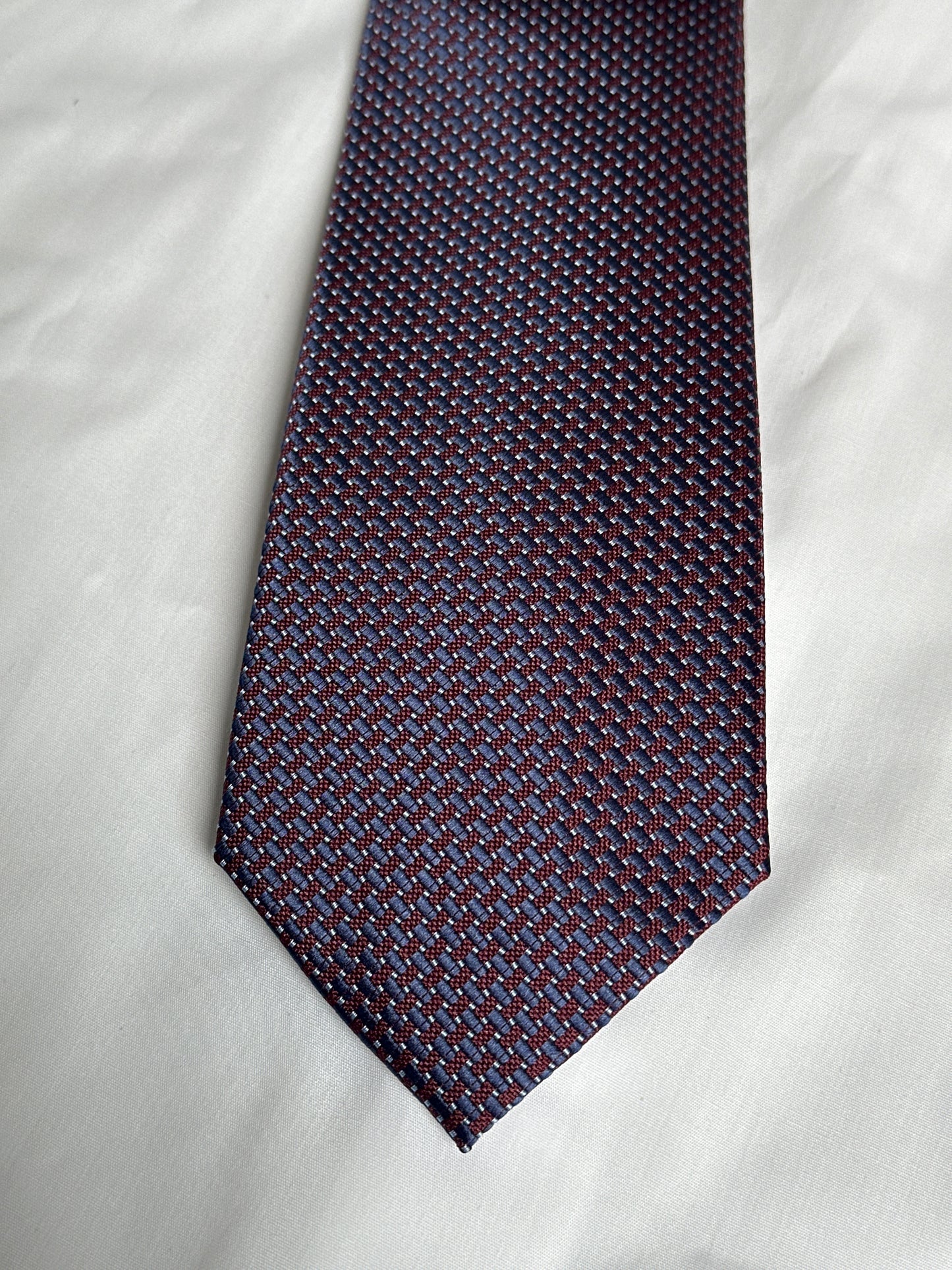 Wine textured tie and matching pocket square at Ryle Menswear, Tralee