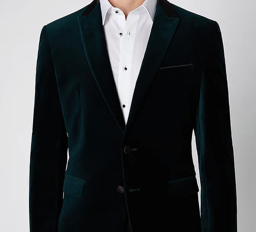 A dark green velvet dinner jacket with a white dress shirt