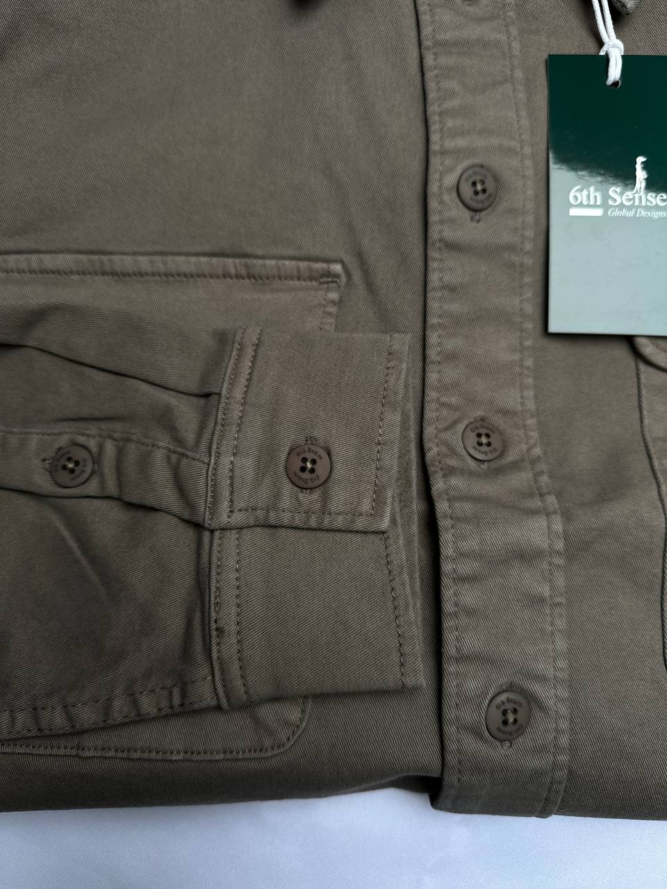 6th Sense Design Falcon overshirt, detail of flap chest pocket and buttoned cuff