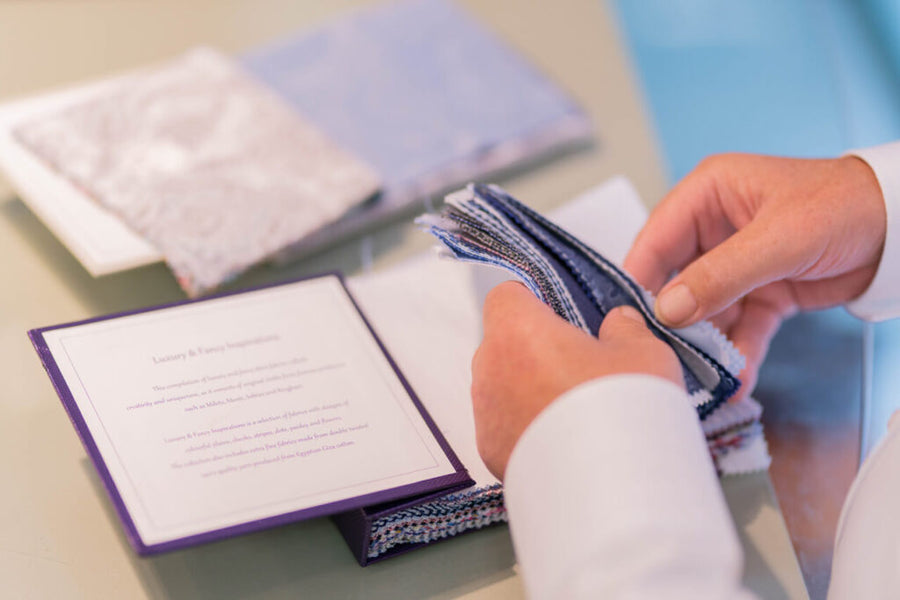 Choosing suit fabric swatches at Ryle Menswear, Tralee